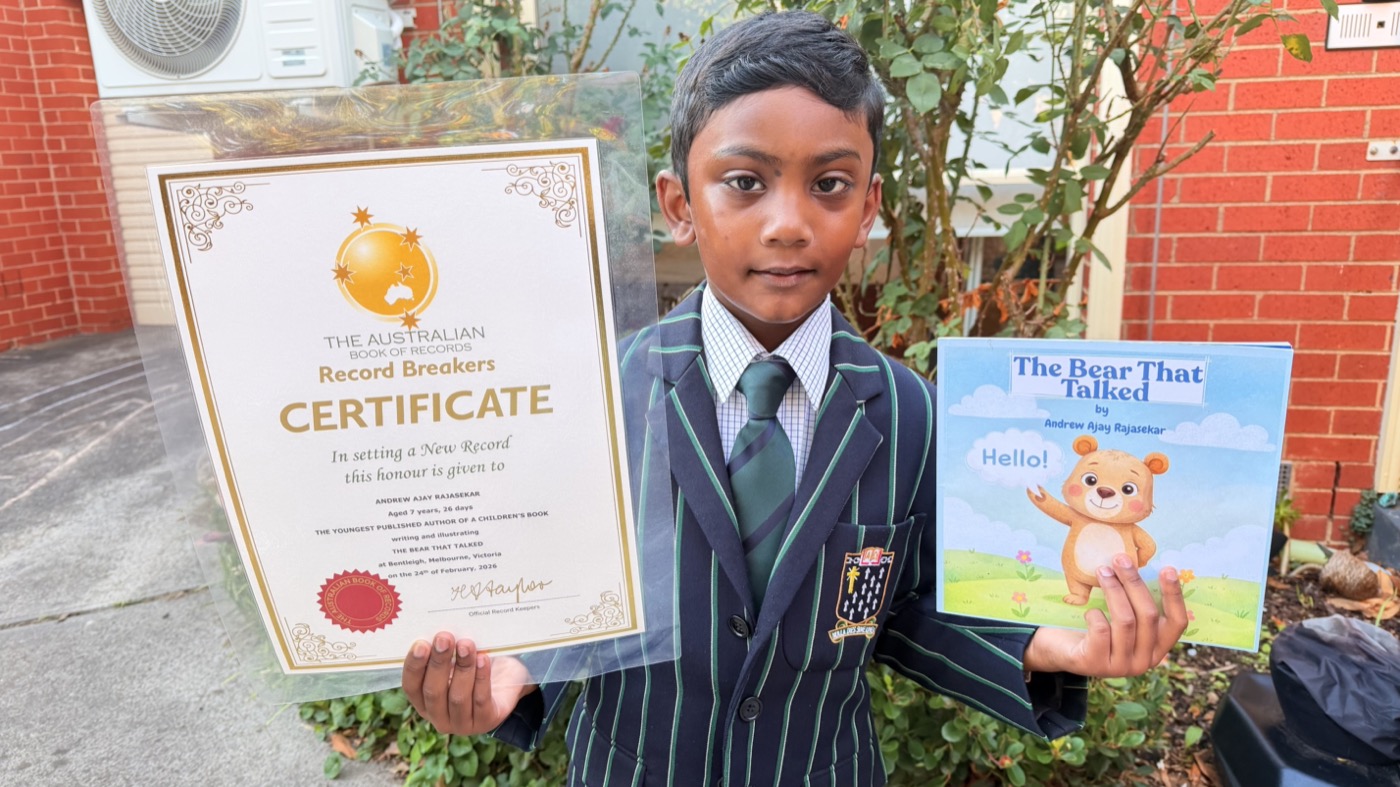 Andrew holding his Australian Book of Records certificate